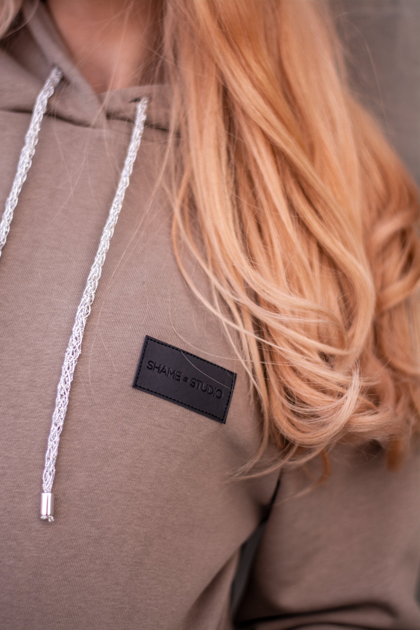 Women beige hoodie with logo badge