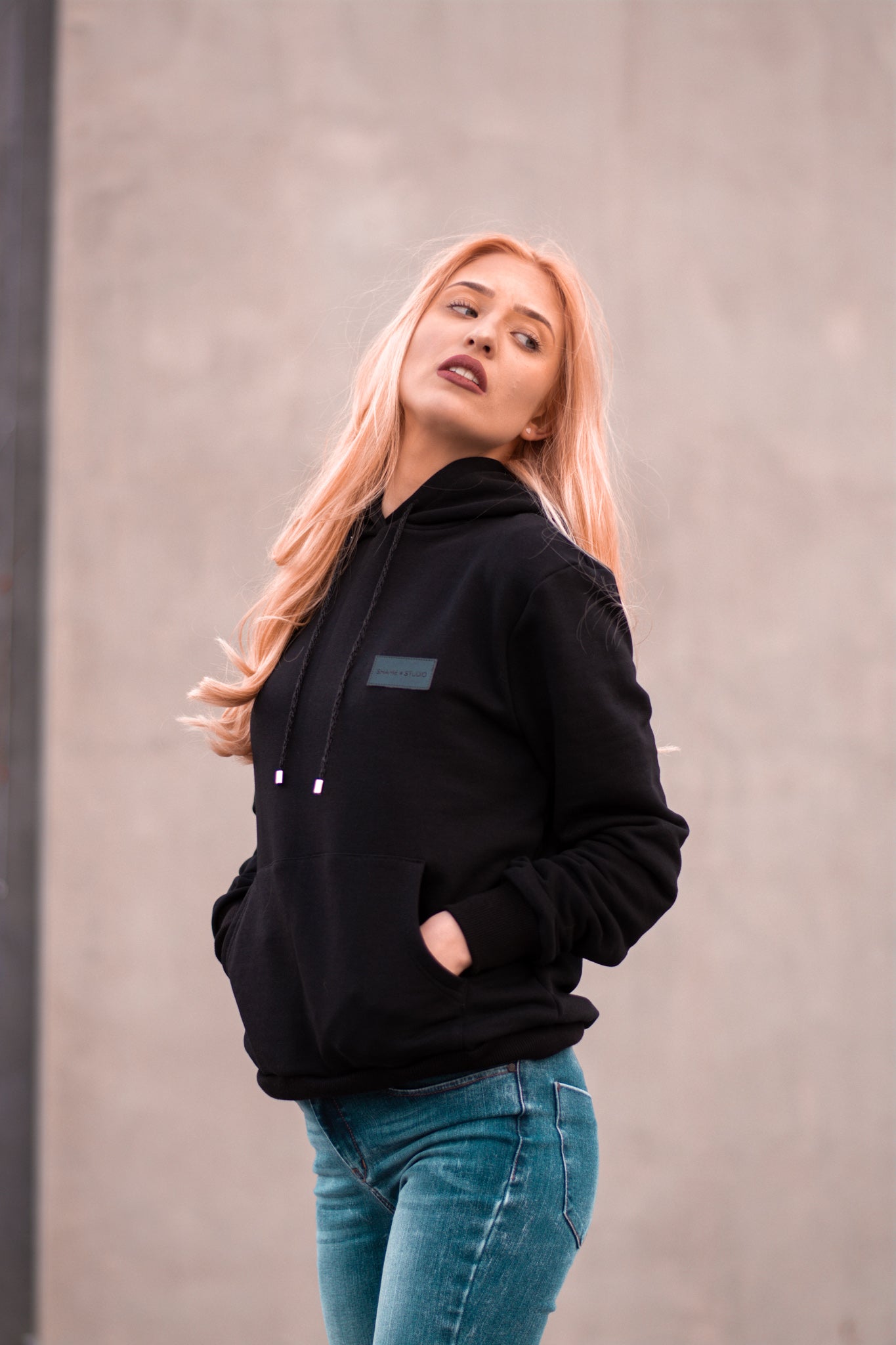 Women black hoodie with logo badge