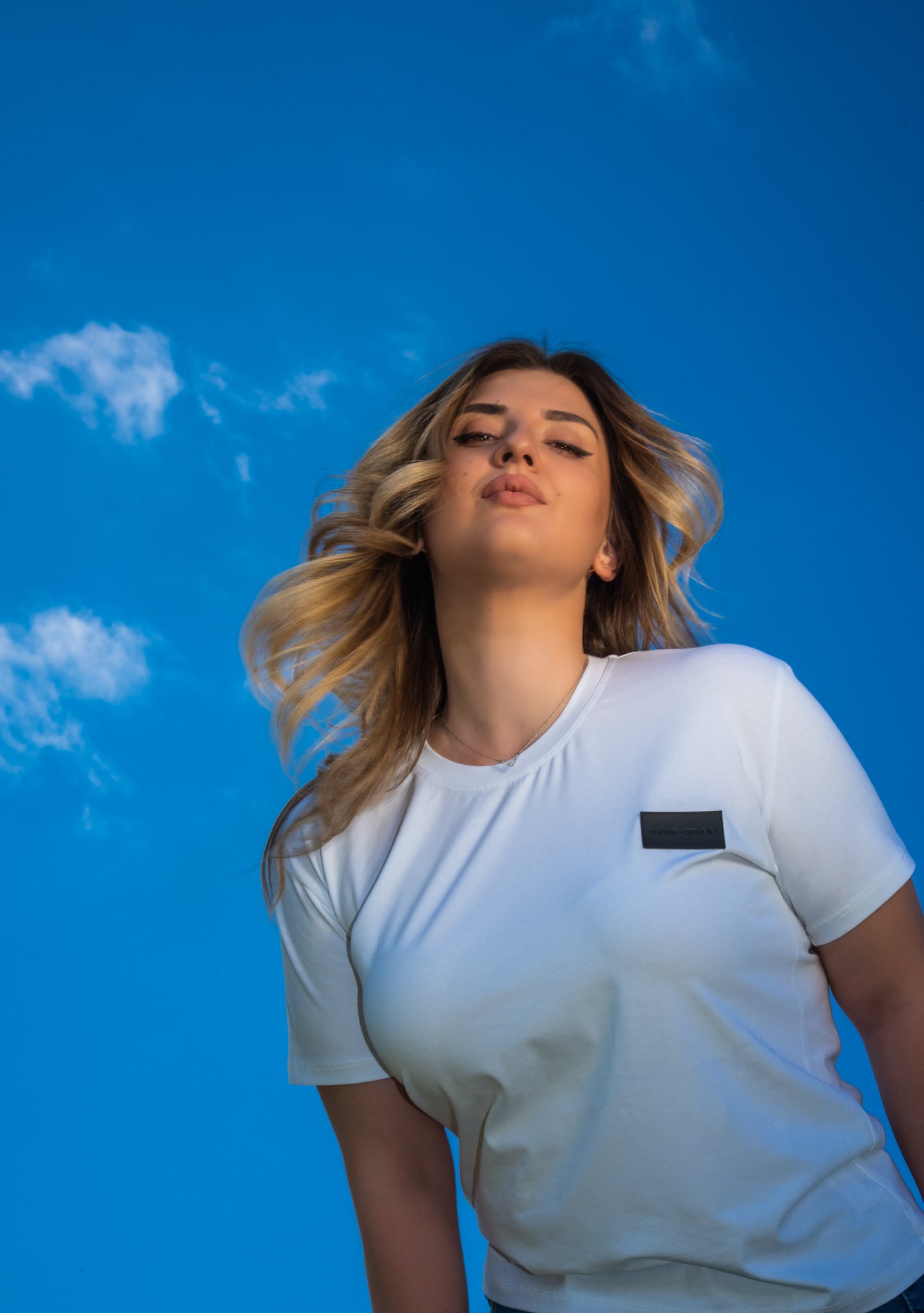 Women white cotton t-shirt with black logo badge